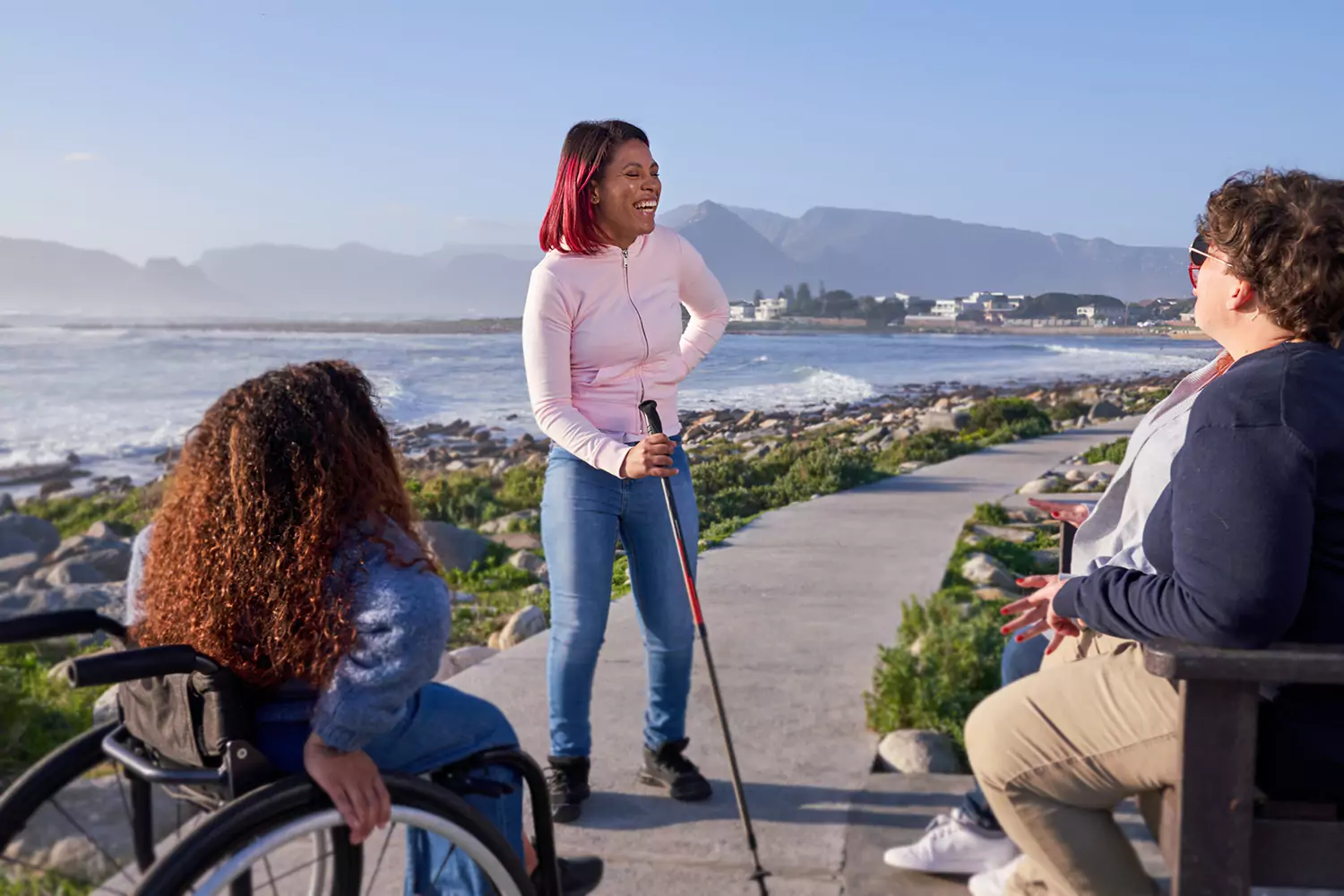 A group of disabled friends having fun while at the beach